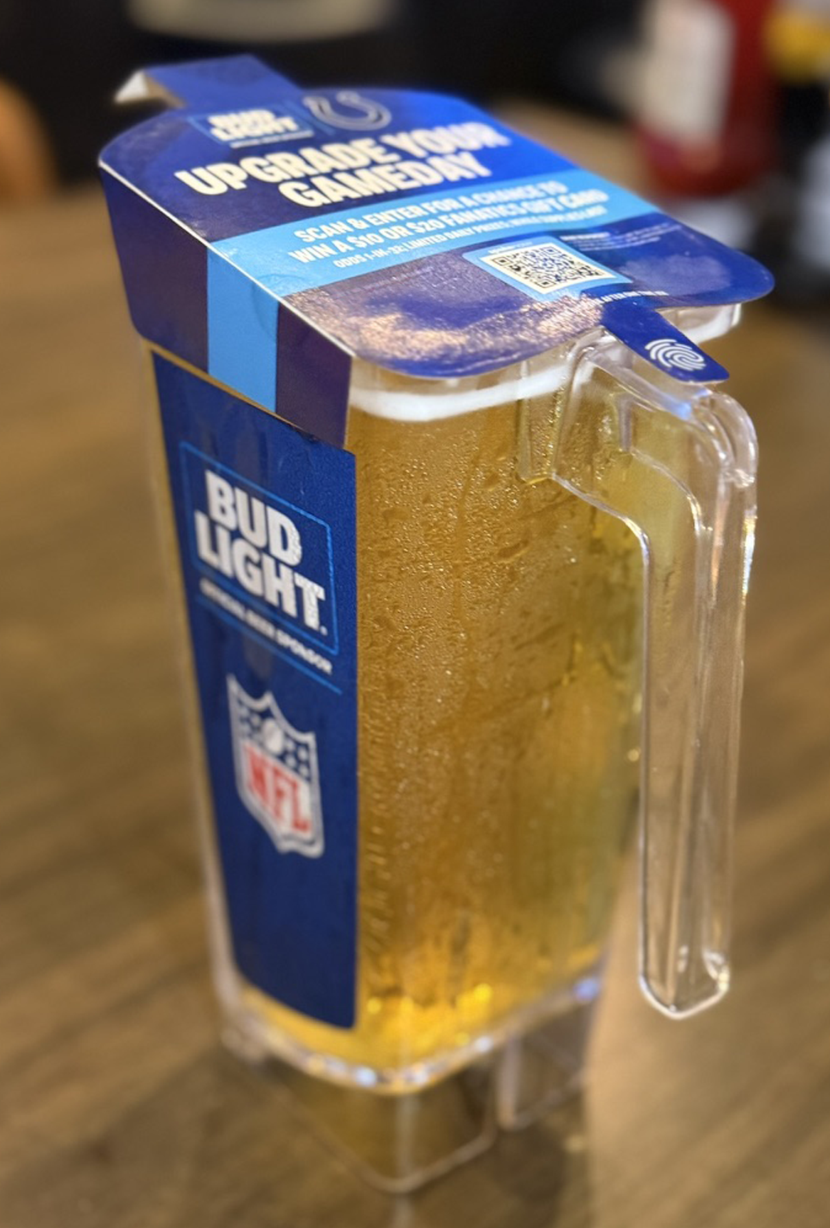A pitcher wrapped with an Upgrade Your Gameday sweepstakes QR code